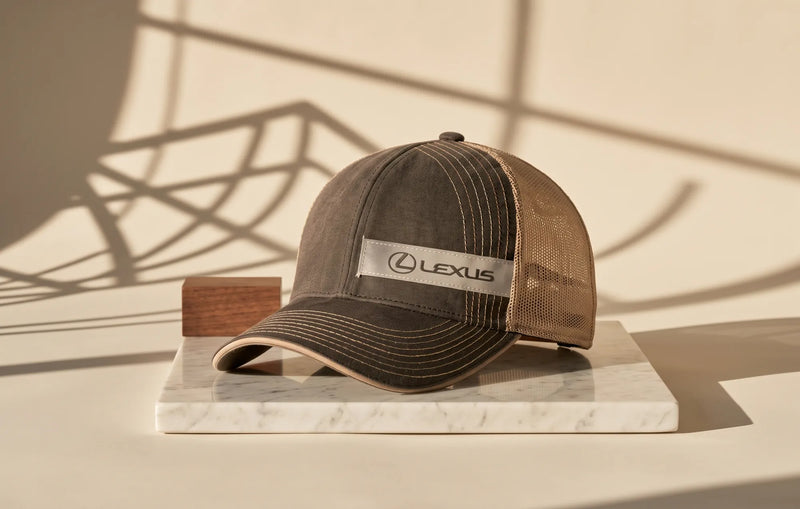 Custom embroidered trucker cap with woven label, corporate merchandise Singapore